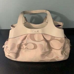 Coach logo purse. Beige with purple liner. New without tags. Never been used.